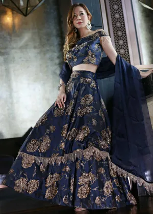 Navy Blue Silk Top, Dupatta and Skirt Featuring Foil Print, Embroidered Butti and Tassels only on Kalki